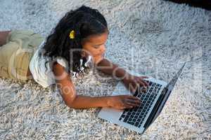 High angle view of girl using laptop