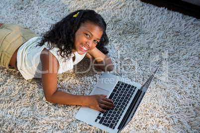Portrait of girl using laptop