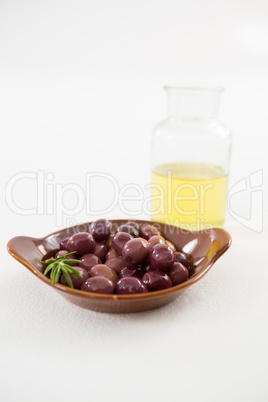 Marinated olives with oil bottle