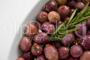 Olives garnished with rosemary