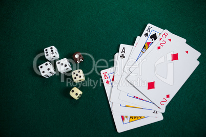 Playing cards and dices on poker table