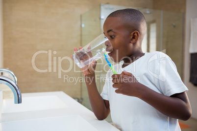 Boy drinking water from glass