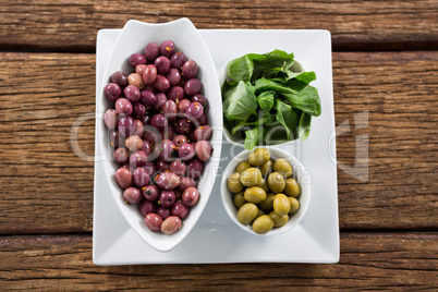 Marinated olives with herbs in bowl