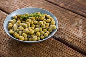 Garnished marinated olives in bowl