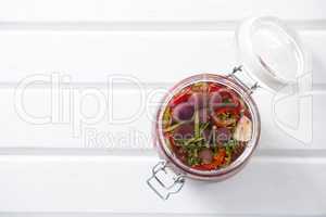 Pickled olives and vegetables in jar