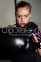 Woman practicing boxing in fitness studio