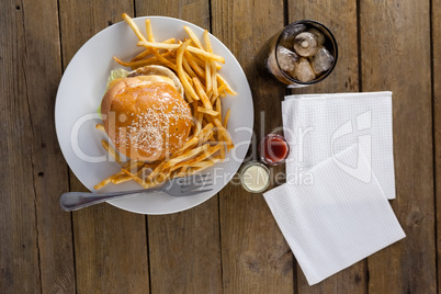 Snacks and cold drink on wooden table