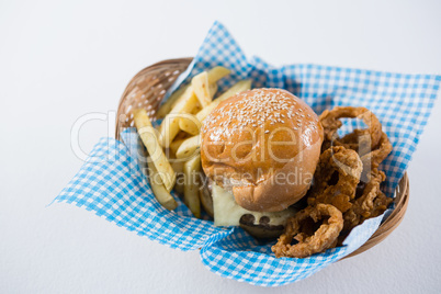 High angle view burger and French fries with onion rings