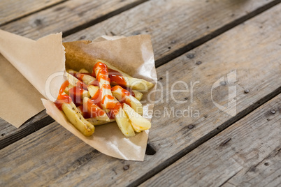 High angle view of French fries with sauce