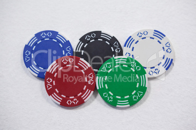 Casino chips arranged on white background