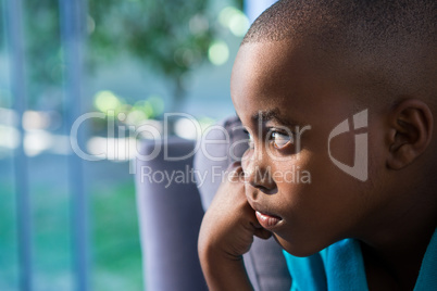 Close-up of thoughtful boy at home