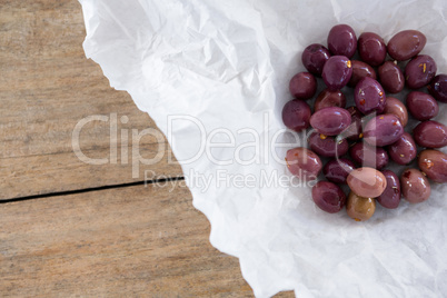 Marinated olives on paper white paper