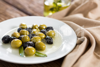 Close-up of marinated olives in plate