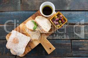 Pickled olives with bread and olive oil