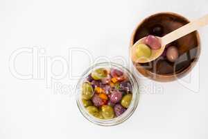 Marinated olives in bowl and jar