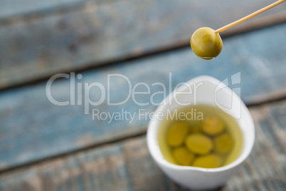 Marinated olive in toothpick