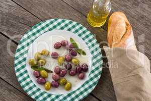 Marinated olives with oil and bread