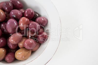 Marinated olives in white bowl