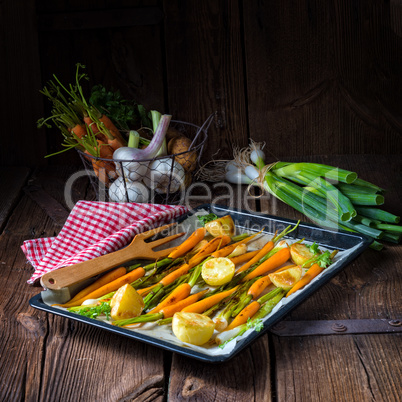 caramelised carrots, spring onions and baked potatoes