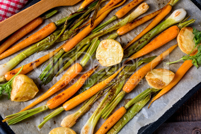 caramelised carrots, spring onions and baked potatoes