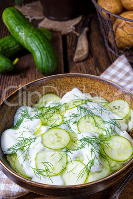 fresh cucumber salad with yogurt and young potatoes