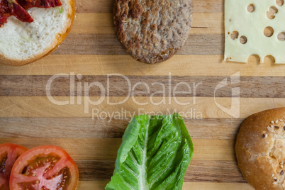Sliced vegetables ingredient for making hamburger on chopping board