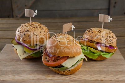 Various hamburger with tag on wooden table