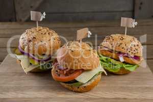 Various hamburger with tag on wooden table