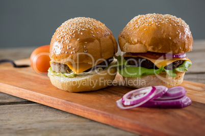 Cheeseburgers with onion and tomato