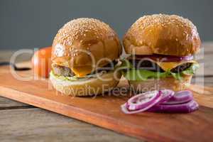 Cheeseburgers with onion and tomato