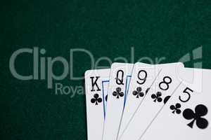 Playing cards arranged on poker table