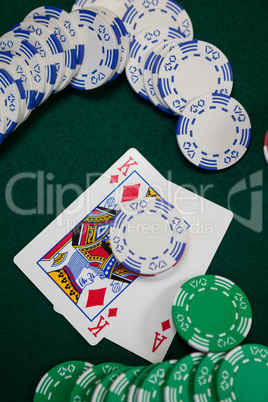 Playing cards and casino chips on poker table