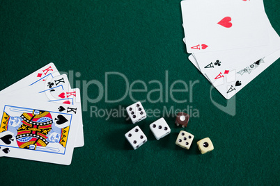 Playing cards and dices on poker table