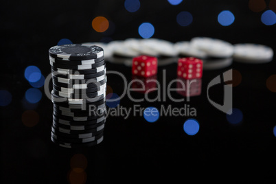 Close-up of chips stacks and dices on table