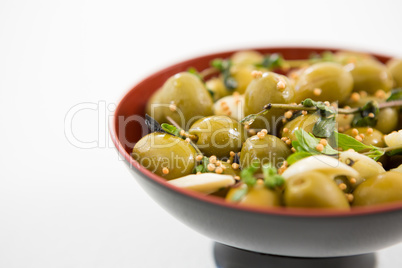 Marinated olives with garlic and herbs in bowl