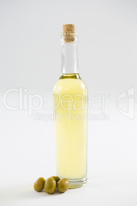 Green olive oil in bottle