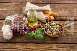 Pickled olives with ingredients and bread