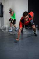 Male boxers exercising in fitness studio