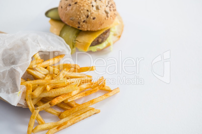 High angle view of French fries by burger