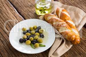Marinated olives with olive oil and breakfast