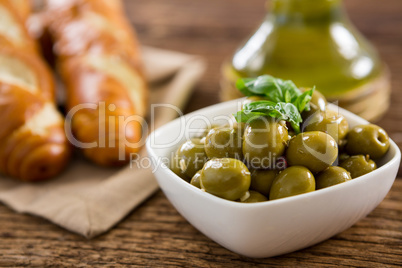 Garnished marinated olives in bowl