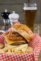 Burger and french fries in basket