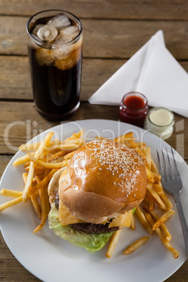 Snacks and cold drink on wooden table