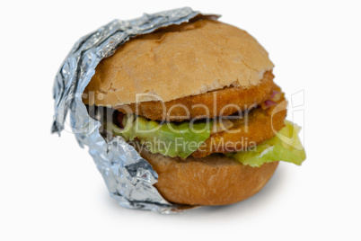 Close-up of hamburger wrapped in foil