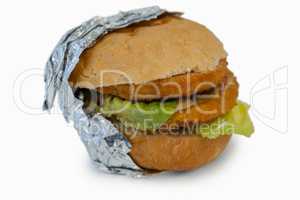 Close-up of hamburger wrapped in foil