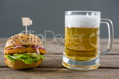Close up of hamburger with beer glass