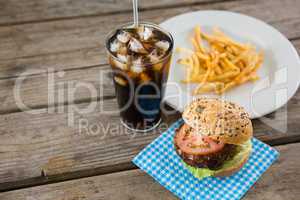 High angle view of hamburger with drink and french fries