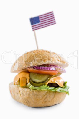 Close up of cheeseburger with American flag