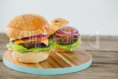 Burgers on cutting board