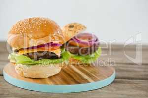 Burgers on cutting board